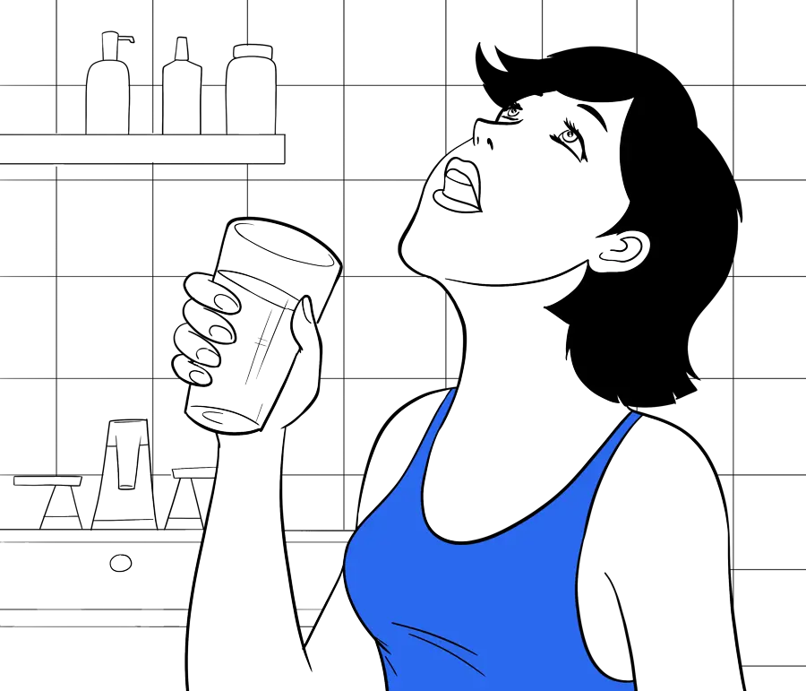 a woman gargling water with a glass of water in her hand